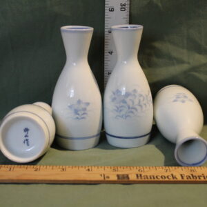 Set of Four White Vases with Delicate Painted Blue Flowers