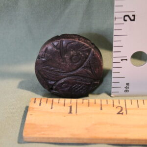 Circular Brown Object with Fish Etchings