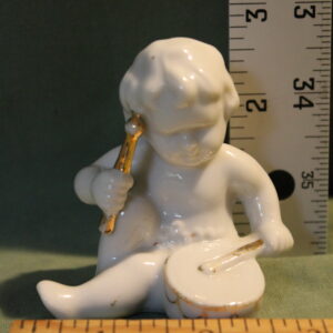Set of Porcelin Cherubs Playing Instruments