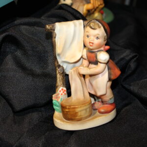 Small Girl Hanging Clothes Figure